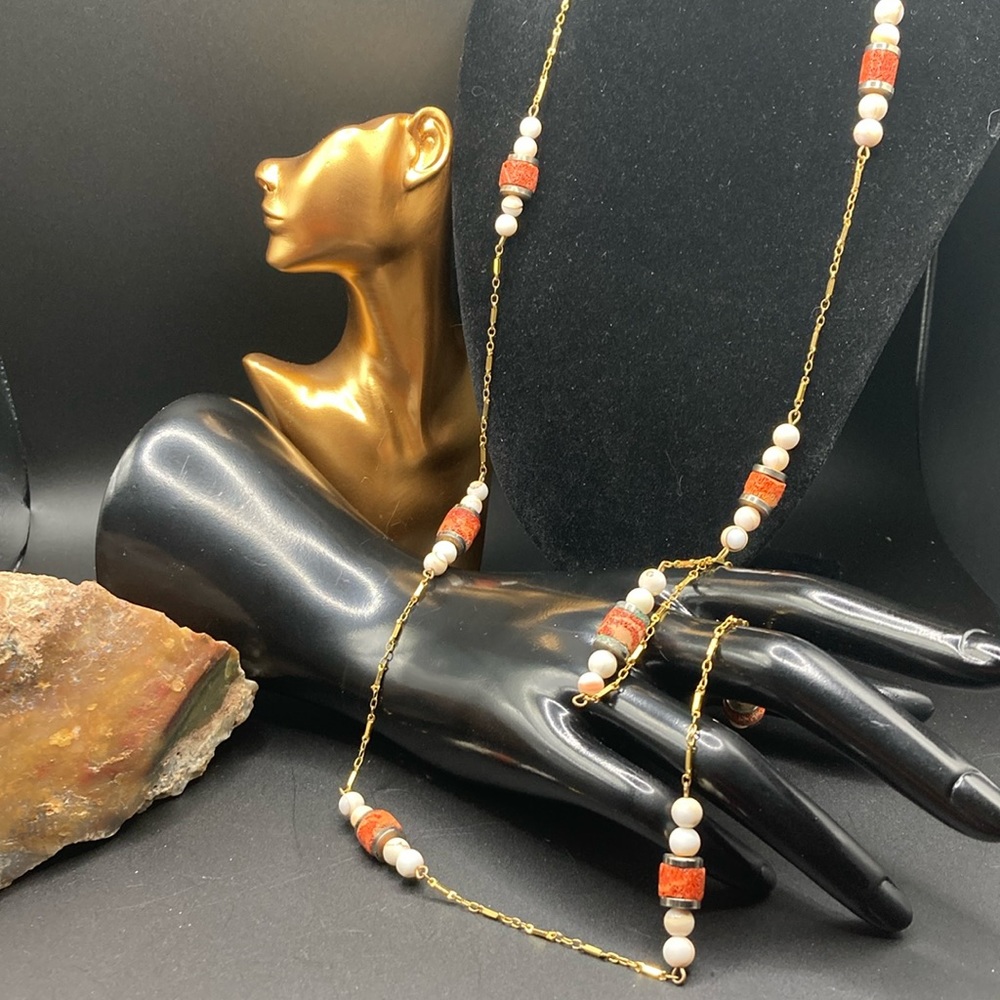 Les Bernard Inc. Gold tone chain necklace with coral and stone beaded stations.